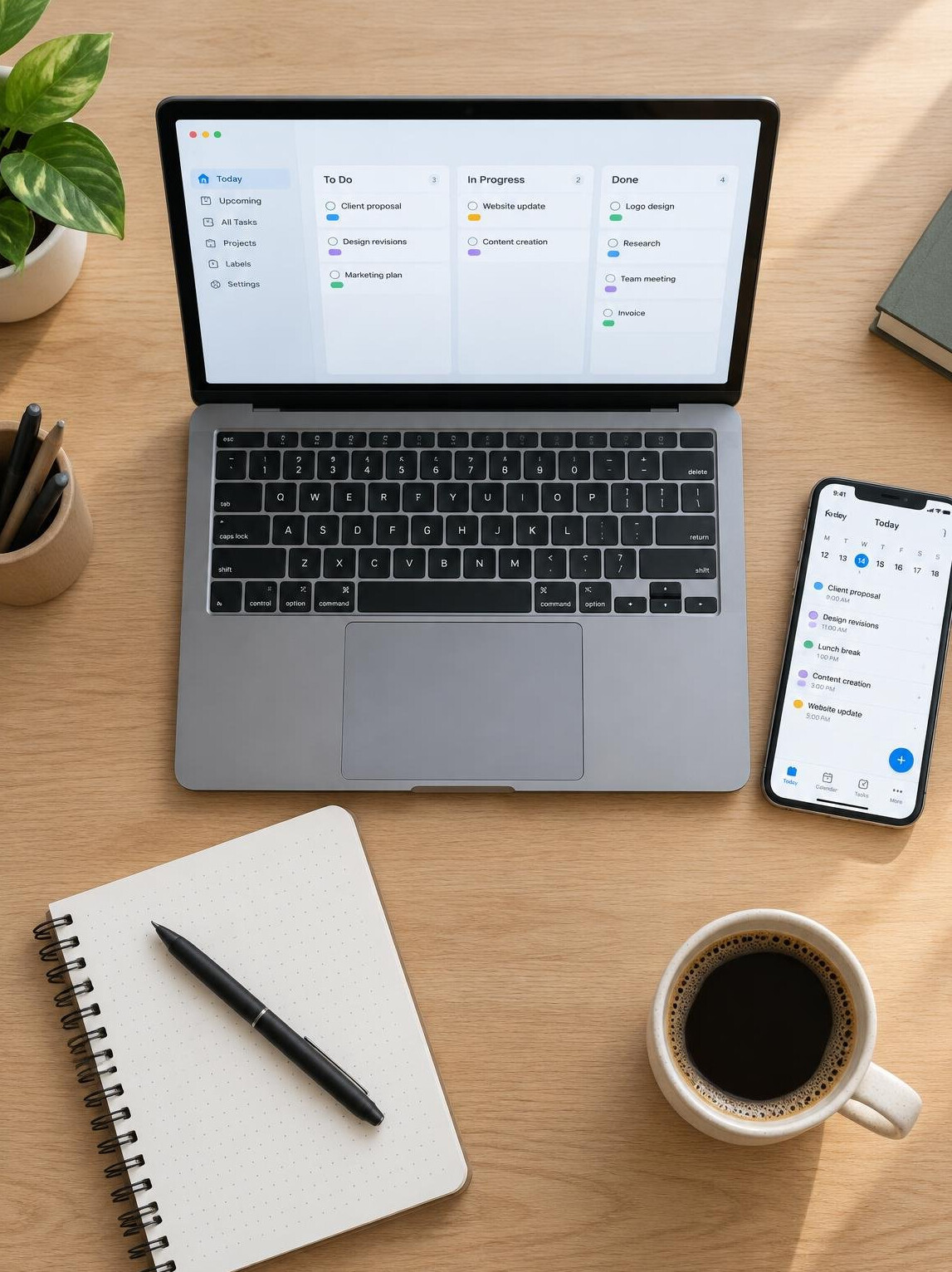 Freelancer desk setup with laptop and phone showing apps