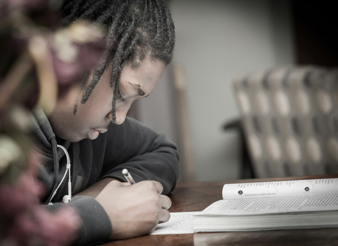 student writing notes